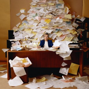 Office Worker with Mountain of Paperwork